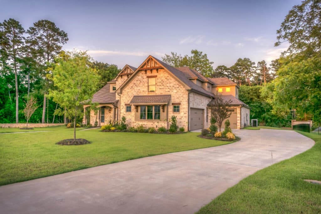 A beautiful, stone-clad house after pressure washing, house washing & power washer services.
